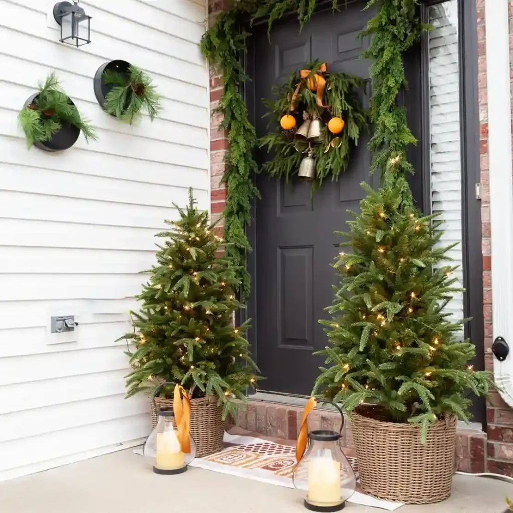 Festive entrance with greenery and lights